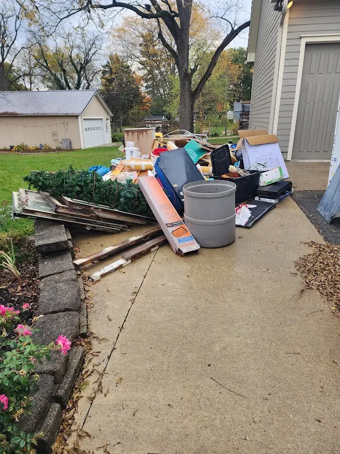 Dumpster being loaded with debris for 30 Yard Dumpster Rental in Coquille
